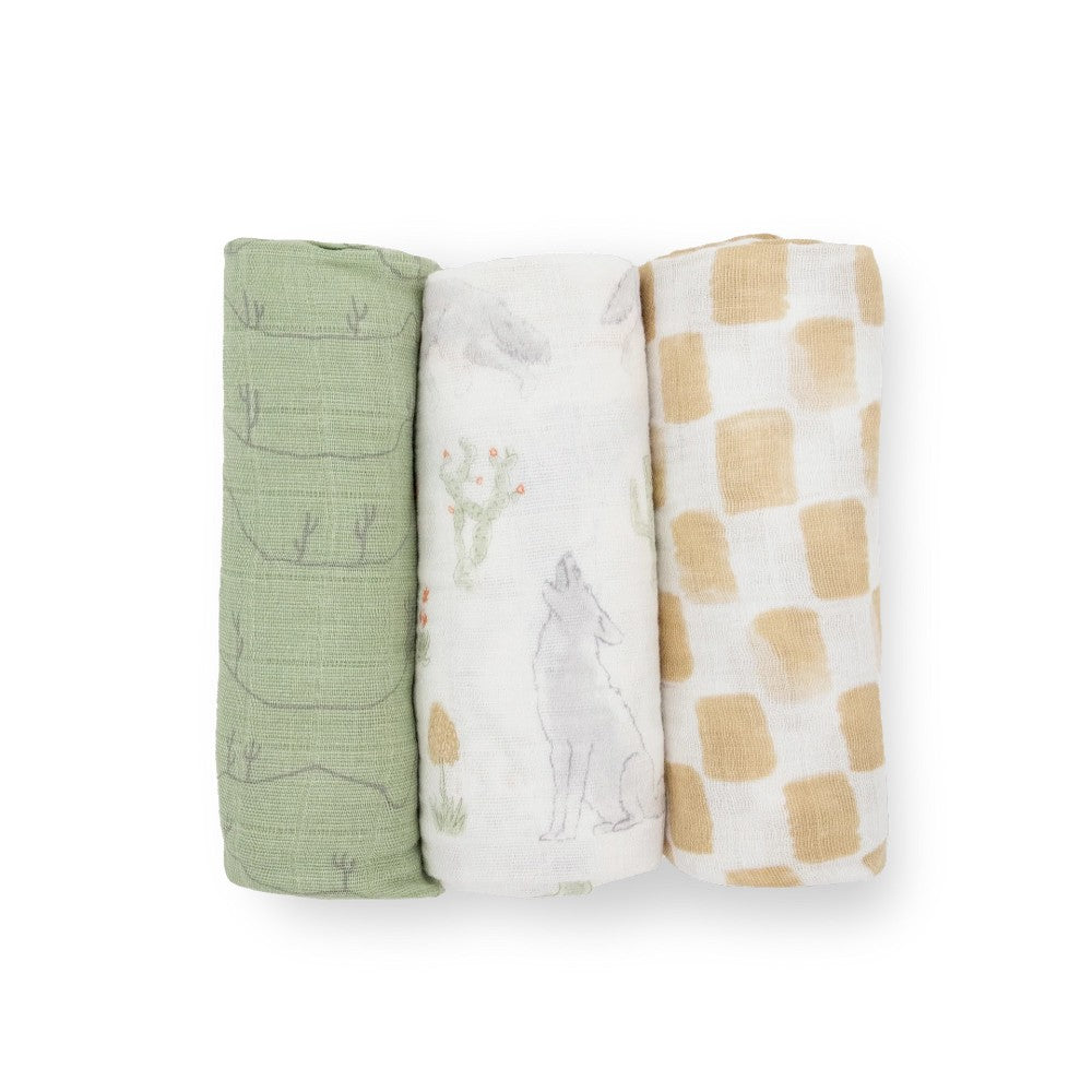 Three cotton muslin baby swaddle blankets with green line, white desert and beige checkered pattern on a white background