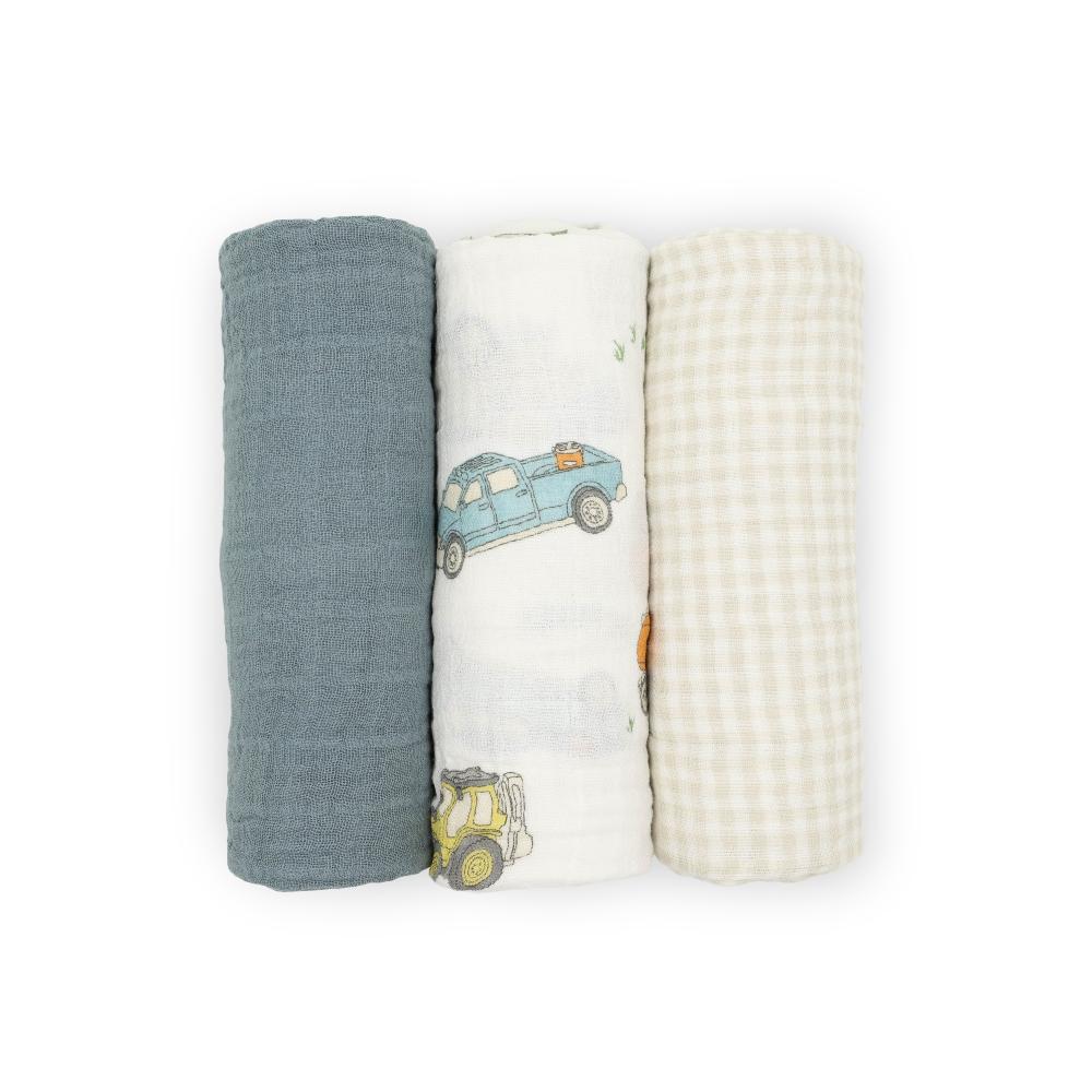 Three baby cotton muslin swaddle blankets with a sea blue, tan gingham and farm vehicle print on a white background