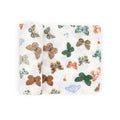A white cotton muslin swaddle blanket with colourful butterfly patterns on a white background