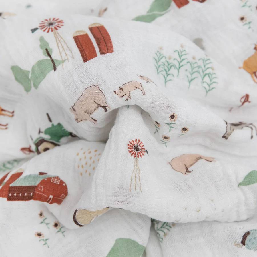 Folded fabric with farm animal pattern on a white background