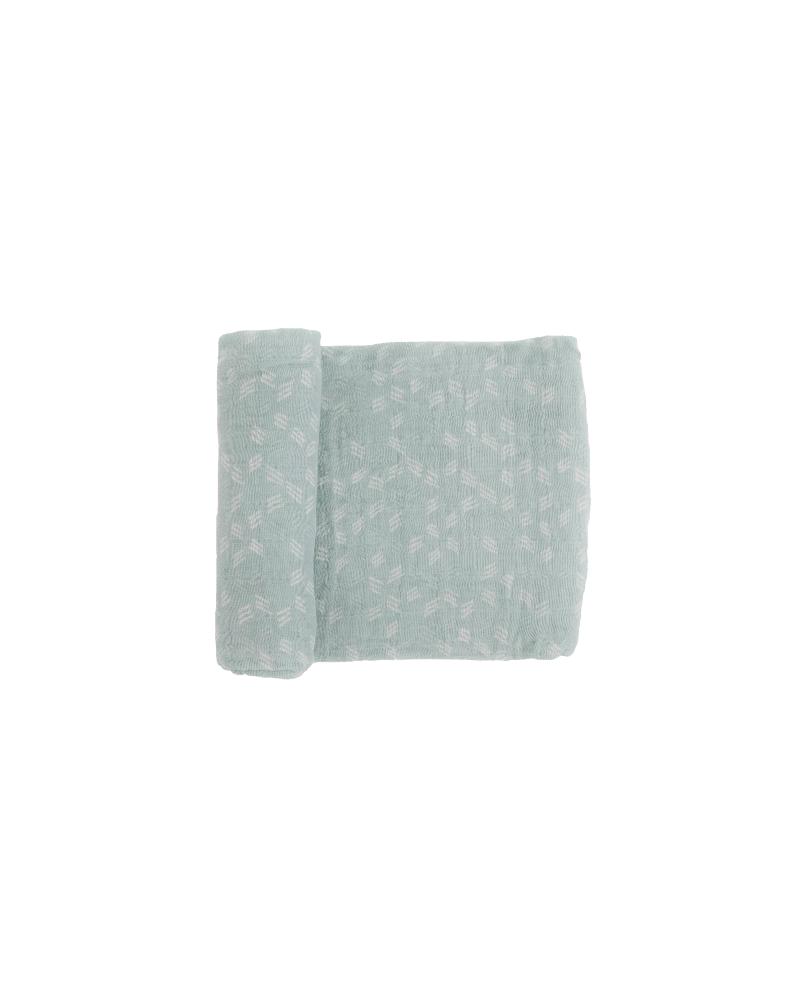 Light green and white patterned cotton muslin fabric on a white background