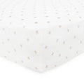 White cot sheet with small gray cross pattern on a mattress with a white background