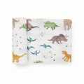 Dinosaur patterned stretch knit fabric swaddle on a white background