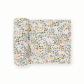 White based floral patterned stretch knit fabric swaddle on a white background