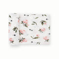 Floral patterned stretch knit fabric swaddle on a white background