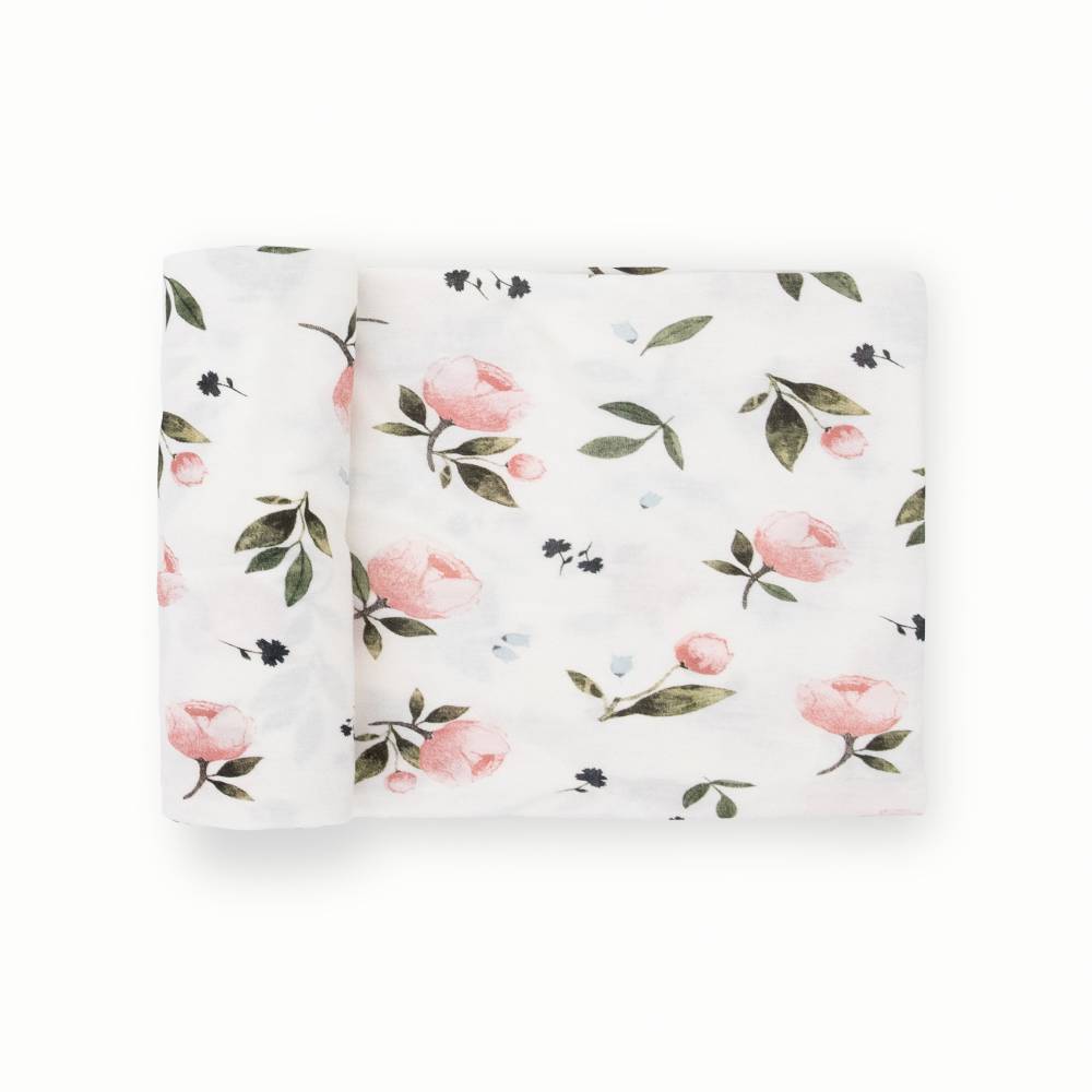 Floral patterned stretch knit fabric swaddle on a white background
