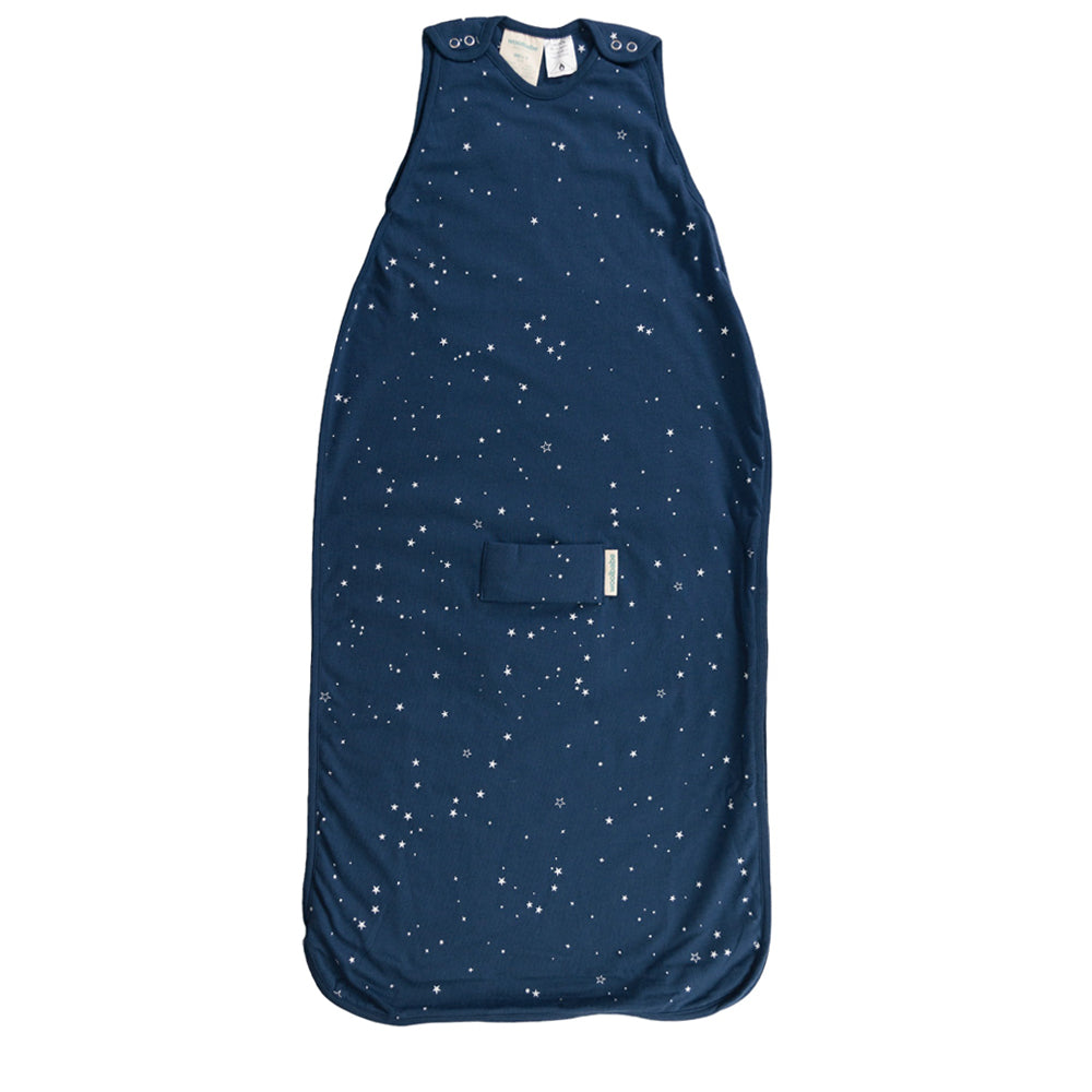 Navy blue woolbabe baby sleeping bag with star pattern on a white background