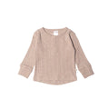 Beige textured long-sleeve woolbabe henley snap top on a white background