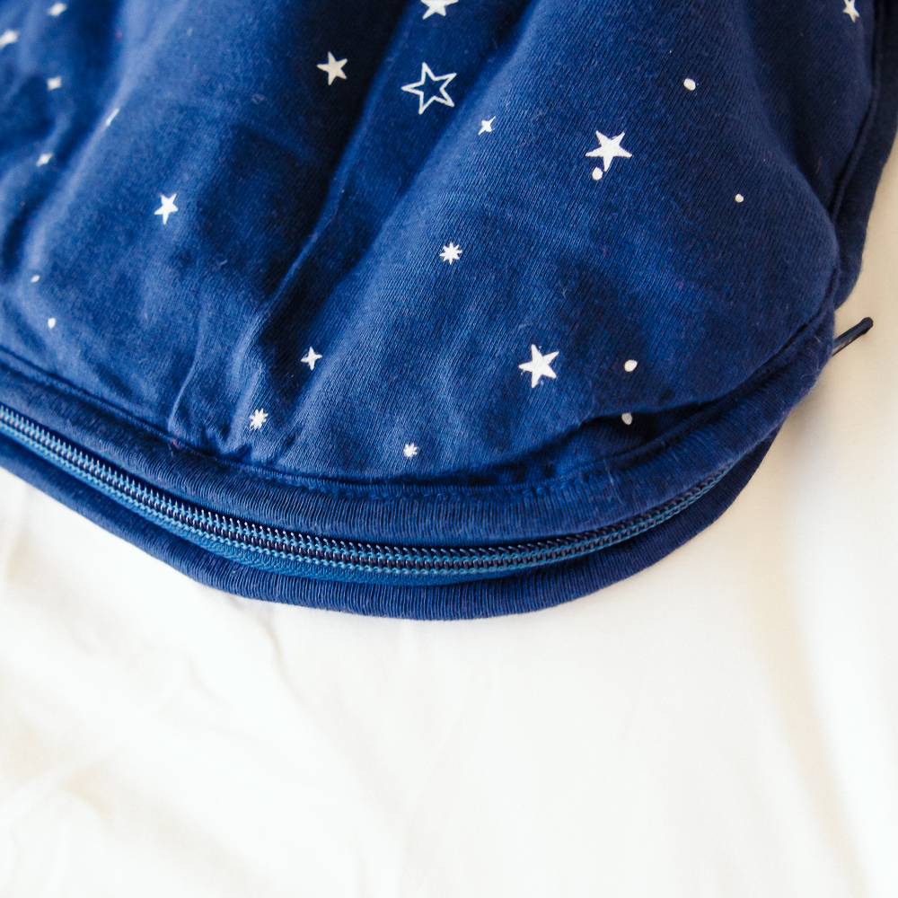 Blue pouch with star patterns on a white background