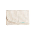 Beige Striped merino blanket with a brand logo on a white background