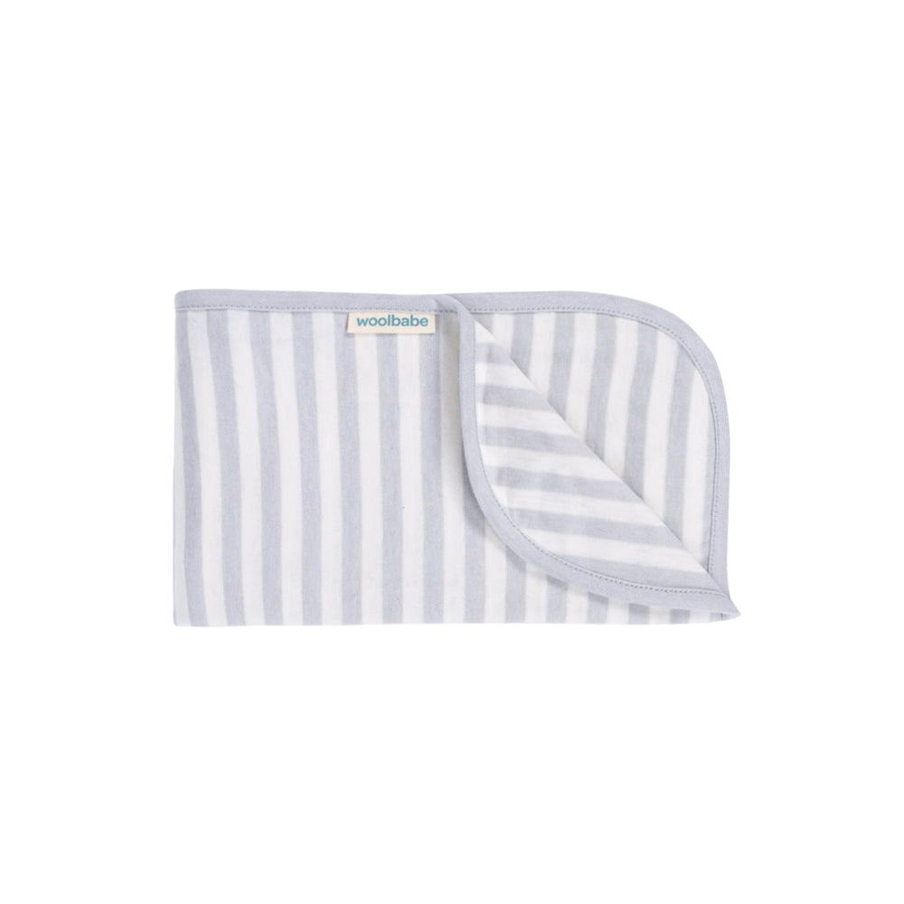Striped grey woolbabe baby blanket with 'woolbabe' branding on a white background