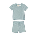 Children's light blue woolbabe pajama set with star pattern on a white background