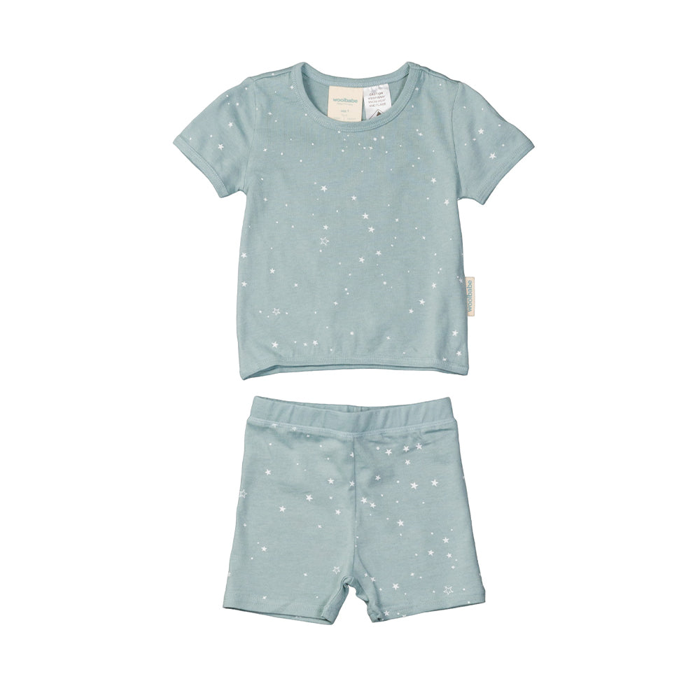 Children's light blue woolbabe pajama set with star pattern on a white background