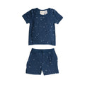 Children's navy blue pyjamas with star patterns on a white background