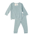 Children's pajama set with long-sleeve top and pants on a white background