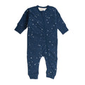 Navy blue baby woolbabe merino onesie with star pattern on a white background