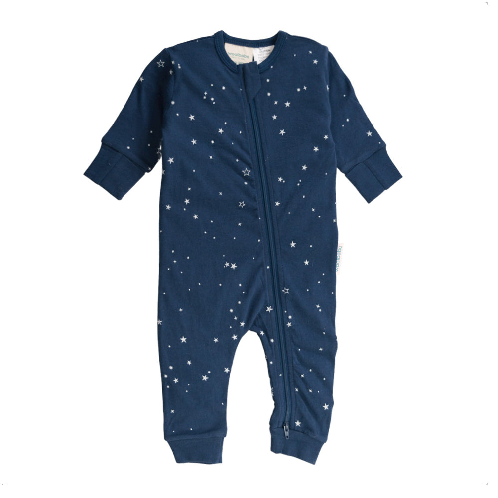 Navy blue baby woolbabe merino onesie with star pattern on a white background