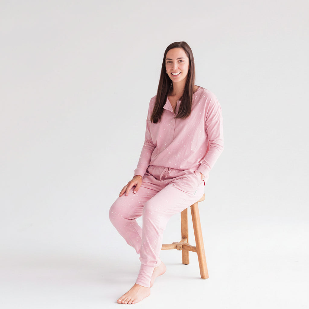 Woman wearing  pink pajama sets on a white background