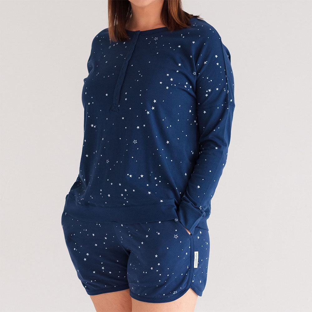 Navy blue loungewear set with star pattern on a plain background