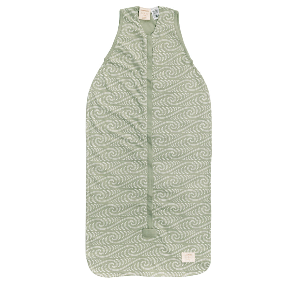 Green Maori patterned summer baby sleeping bag on a white background