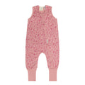 Pink children's merino sleepsuit with a pattern on a white background
