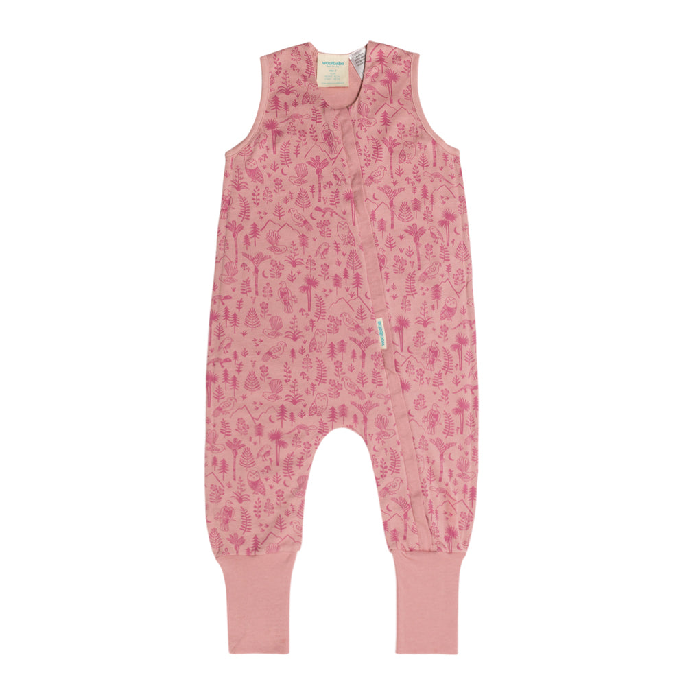 Pink children's merino sleepsuit with a pattern on a white background