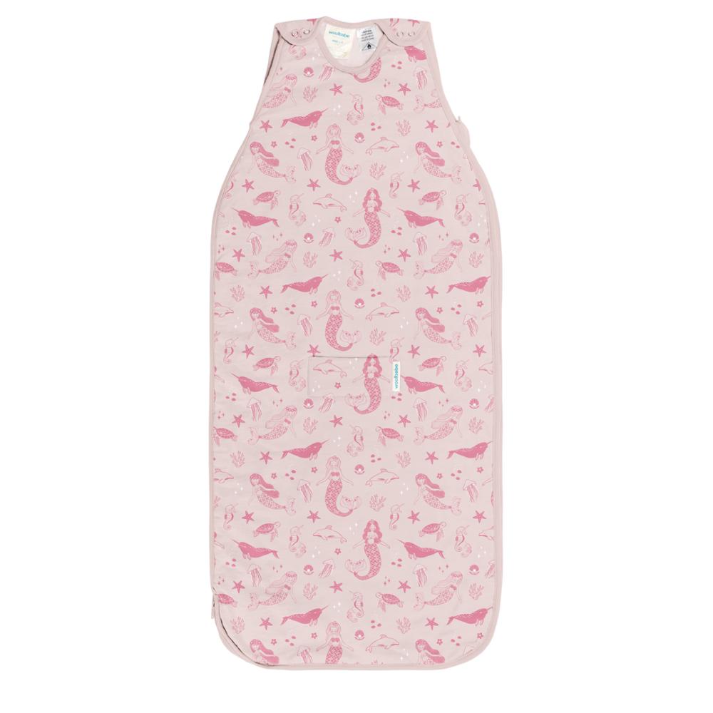 Pink woolbabe baby sleeping bag with mermaid pattern on a white background