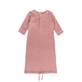 Pink ribbed woolbabe gown with a tie at the bottom on a white background