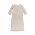 cream mark baby gown made from merino with long sleeves on a white background
