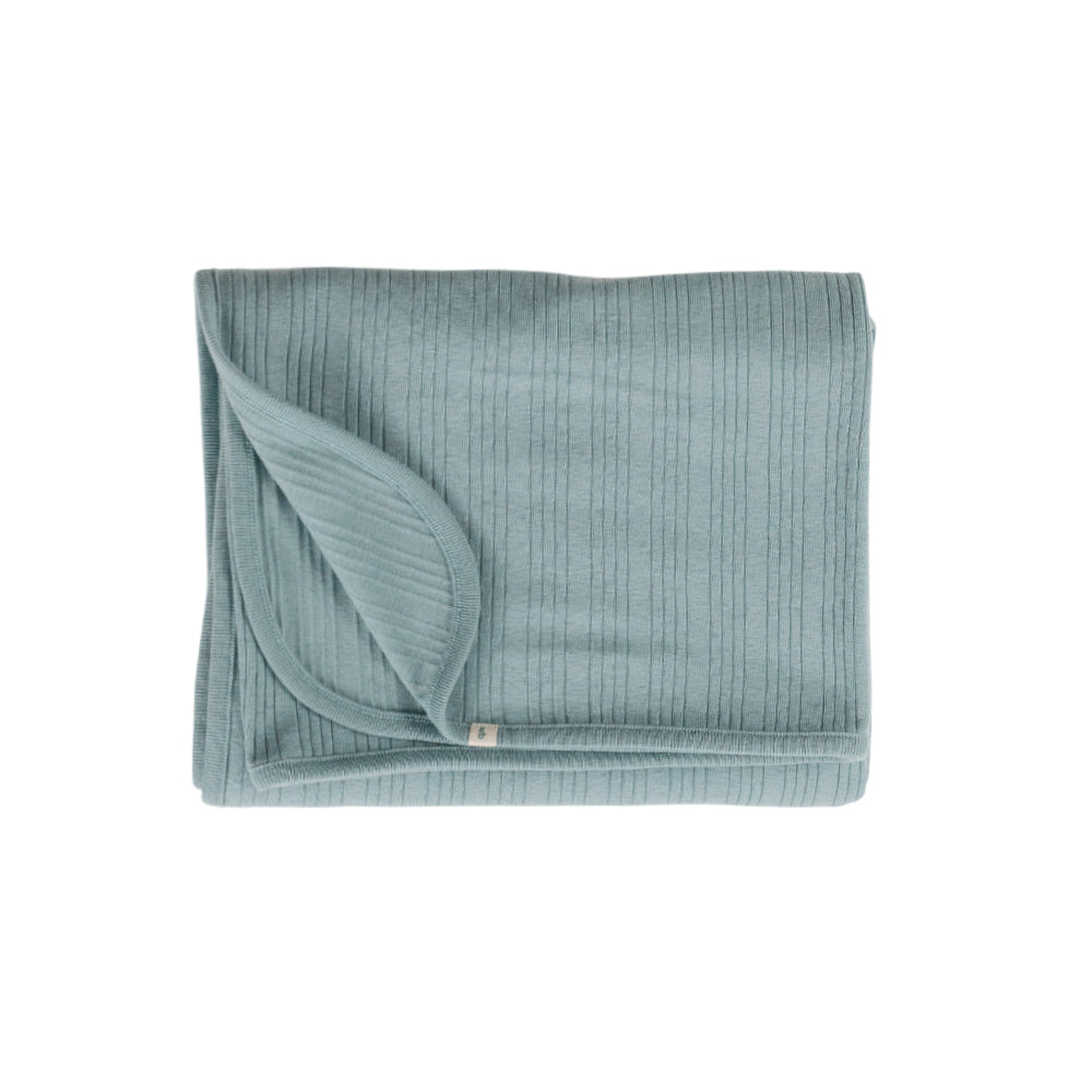 Folded teal fabric on a white background