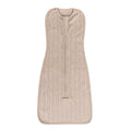 Beige merino zip swaddle with a subtle pattern on a white background