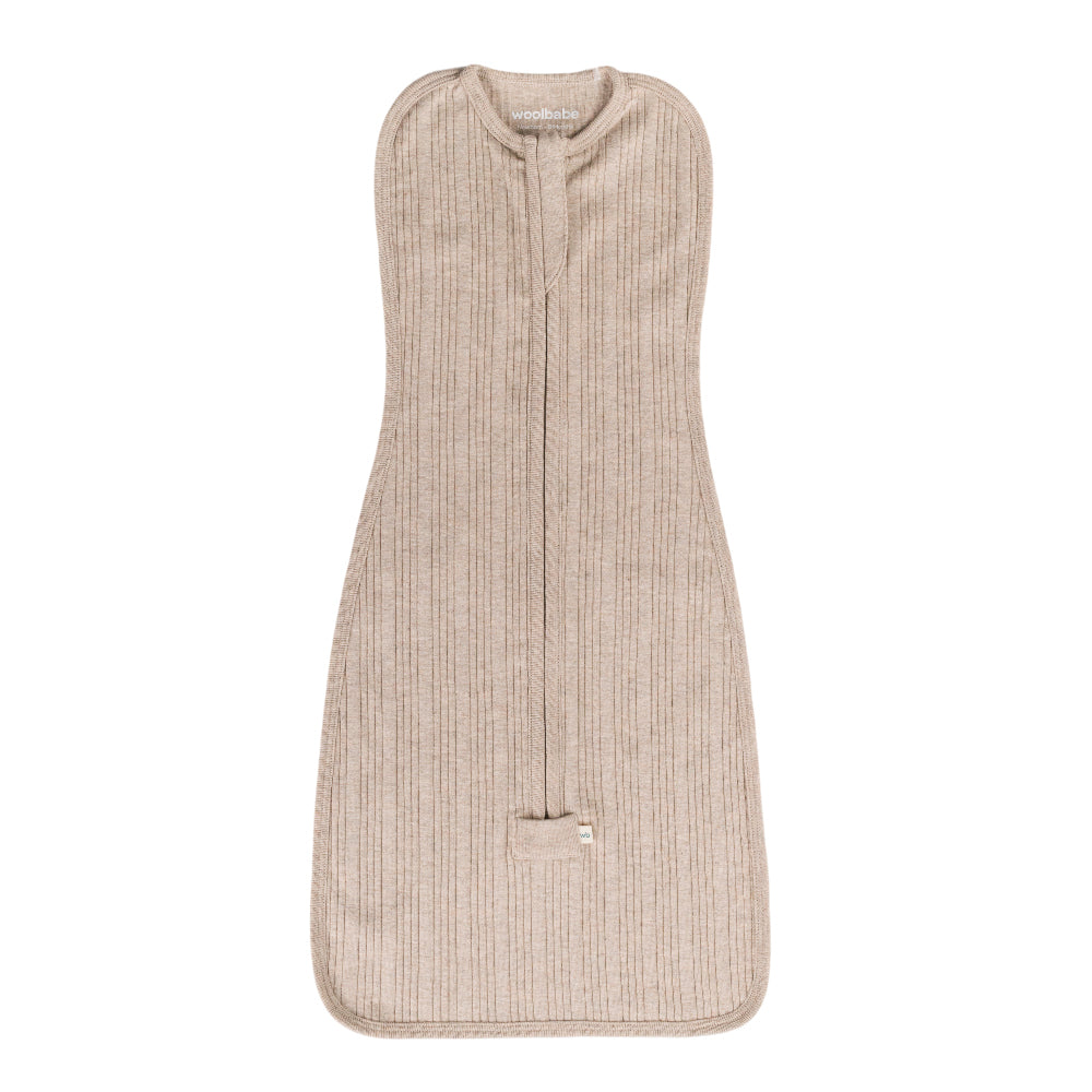 Beige merino zip swaddle with a subtle pattern on a white background