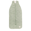 Green maori patterned baby sleeping bag on a white background