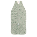 Green baby sleeping bag with dino nature-themed pattern on a white background