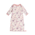Floral patterned newborn merino baby gown on a white background
