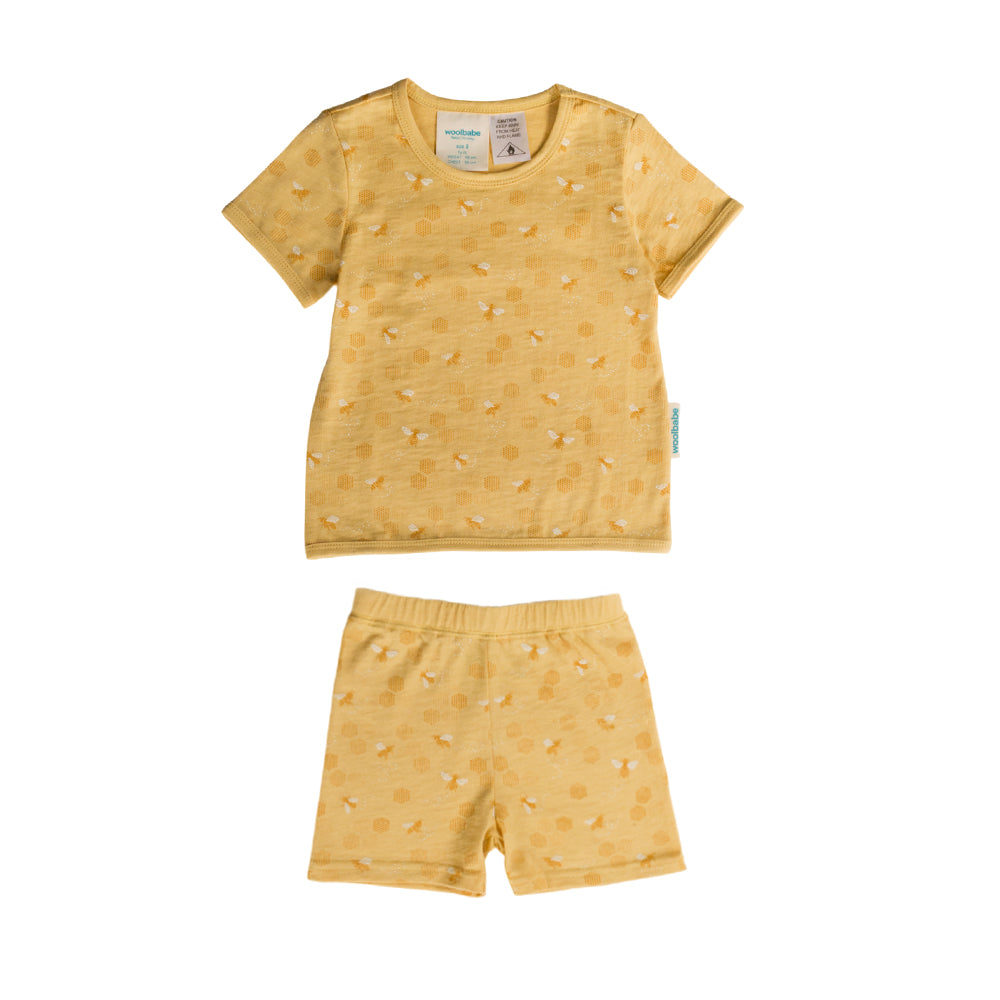 Yellow children'swoolbabe summer pyjamas with bee print  on a white background