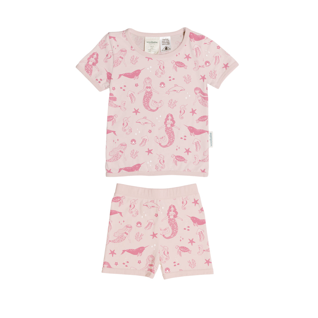 Children's pink woolbabe summer pajama set with mermaid pattern on a white background