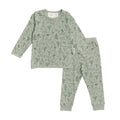 Children's pajama set with dinosaur nature-themed pattern on a white background