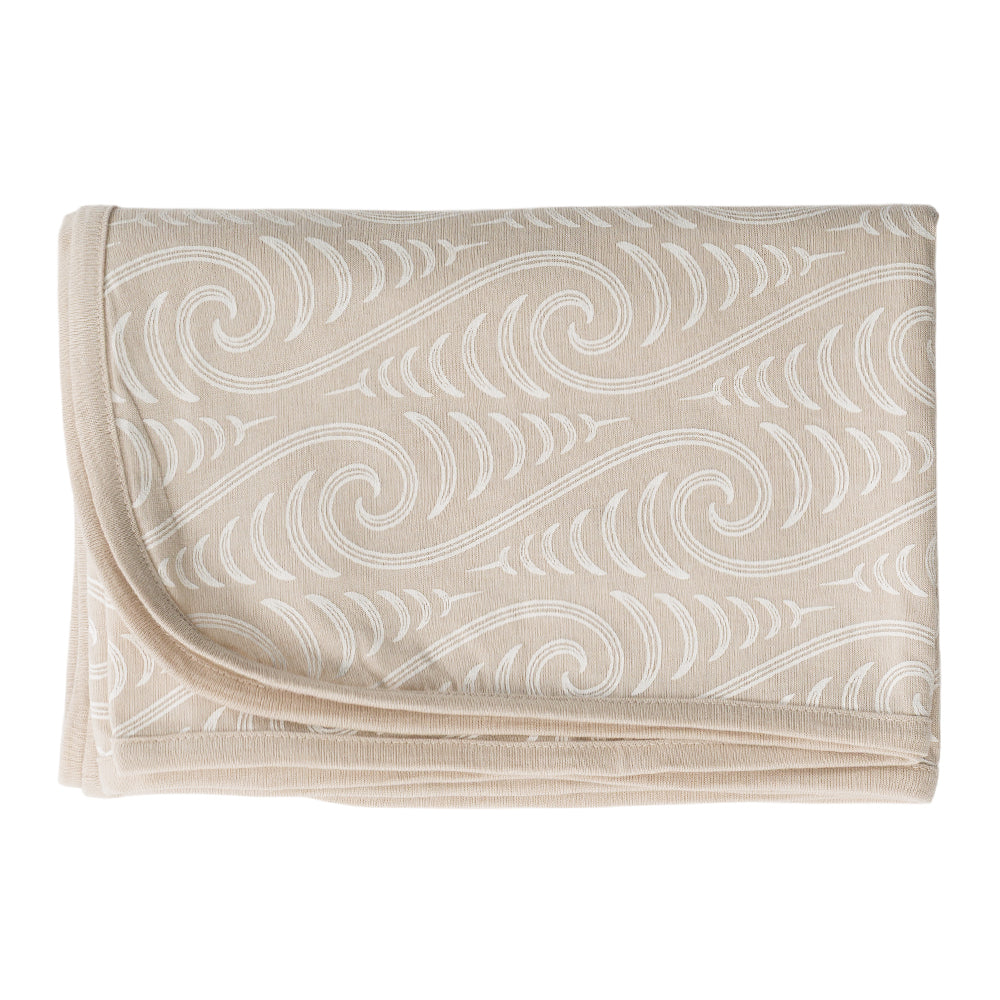 Beige fabric with white Maori Bo + Ko wave pattern on a white background