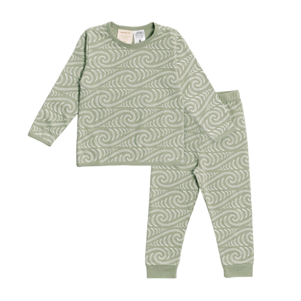 Children's Bo + Ko woolbabe pajama set with Maori wave pattern on a white background