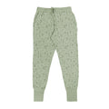 Light green lounge  pants with a subtle nature and dinosaur pattern on a white background
