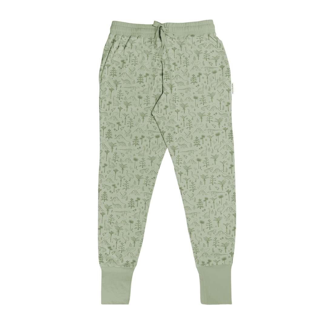 Light green lounge  pants with a subtle nature and dinosaur pattern on a white background