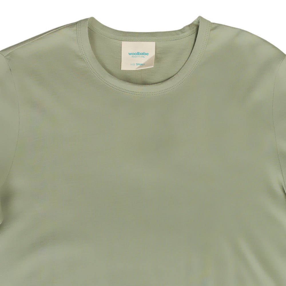Green t-shirt with a visible brand label on a white background