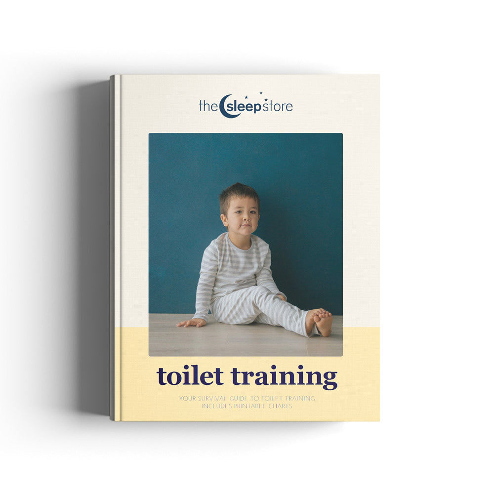 An ebook titled 'toilet training' by 'the sleep store' shown standing upright against a white background. The cover features a photo of a young child sitting against a dark teal background, with a pale yellow band at the bottom.