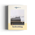 An ebook titled 'bedwetting' by 'the sleep store' is shown standing upright against a white background. The cover features a photograph of a bed with gray bedding and a small teddy bear on the floor, with the title 'bedwetting' printed in dark blue text on a pale yellow band at the bottom.