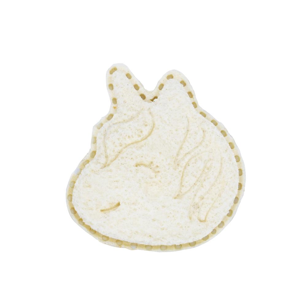 White unicorn-shaped cookie on a white background