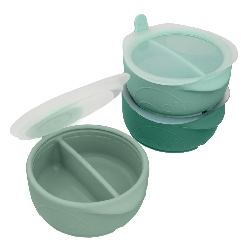 3 Green silicone food containers with compartments and a lid on a white background
