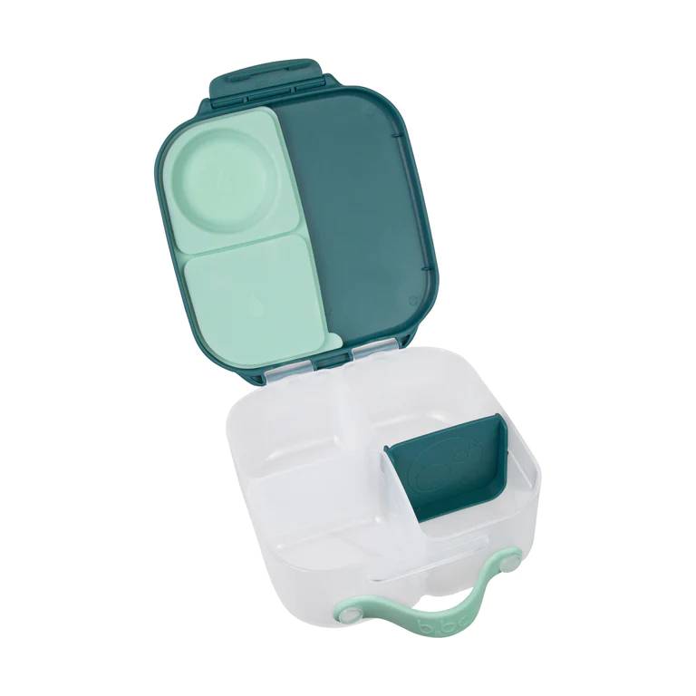Green and white food mini lunch box with compartments on a white background
