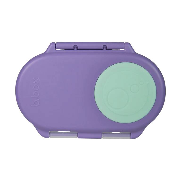 Purple snack container with a green lid on a white background