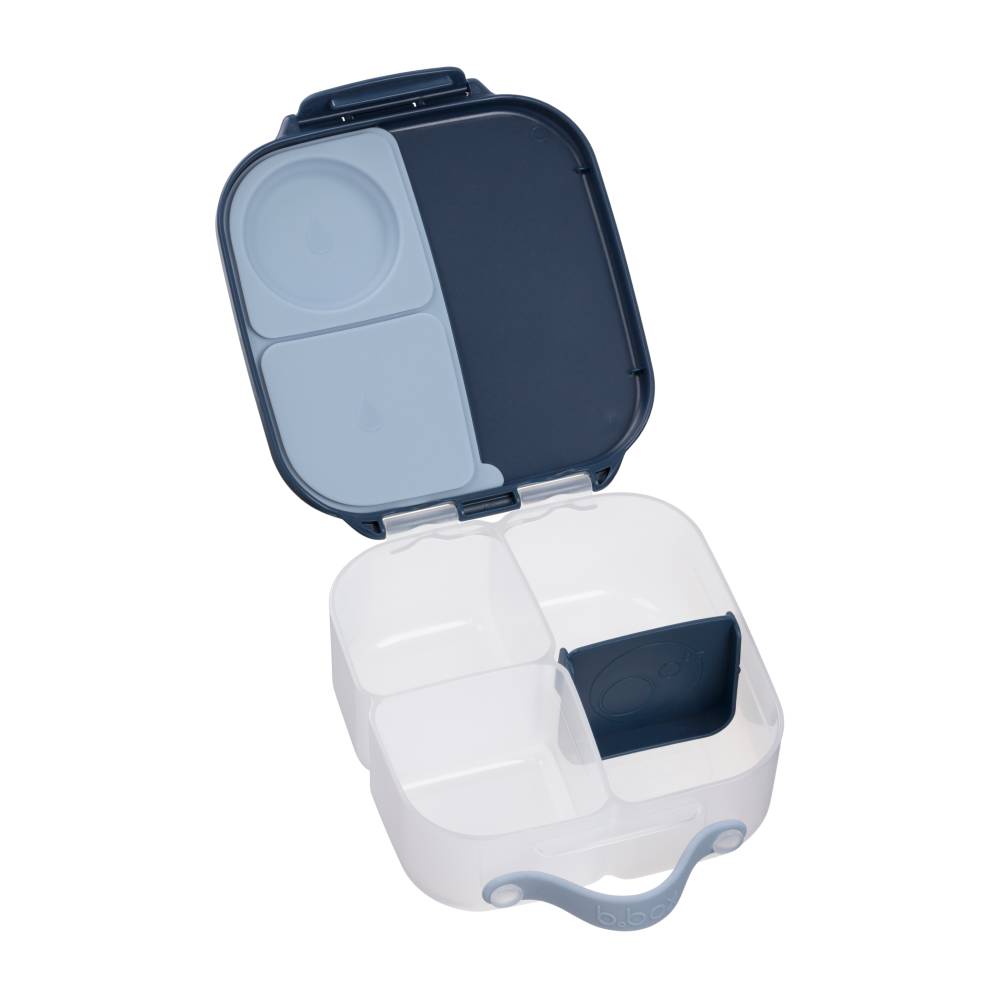 White and blue compartmentalized mini lunch box with open lid on a white background